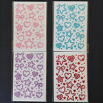 feuilles autocollantes motifs cœurs étoiles rubans abstrait rose jaune bleu violet rouge enfants