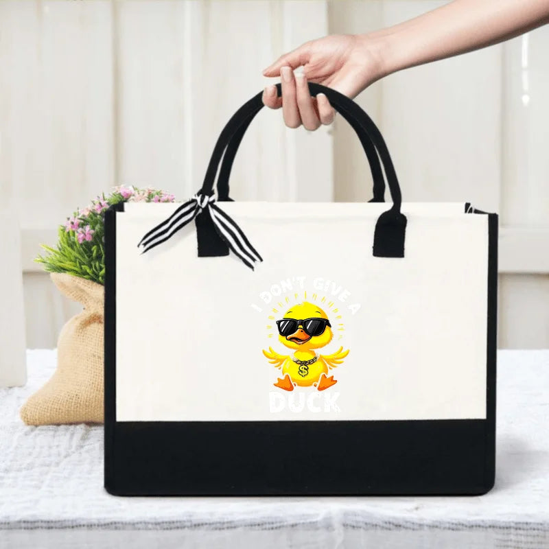 sac main toile beige noir canard lunettes soleil respectueux environnement moderne casual