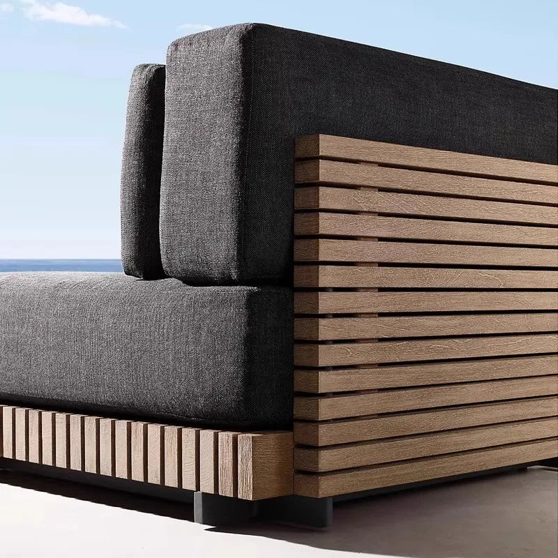canapé extérieur modulable gris foncé tissu bois naturel coussins pieds noirs moderne minimaliste