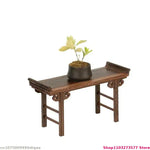meuble pliant bois sculpté finition lisse traditionnel artisanal plateau pieds marron foncé