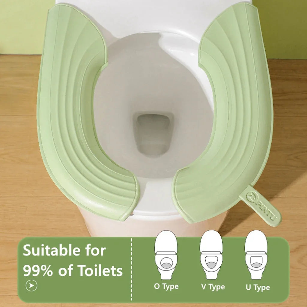 siège toilette pliable vert clair moderne texture souple clips fixation pratique