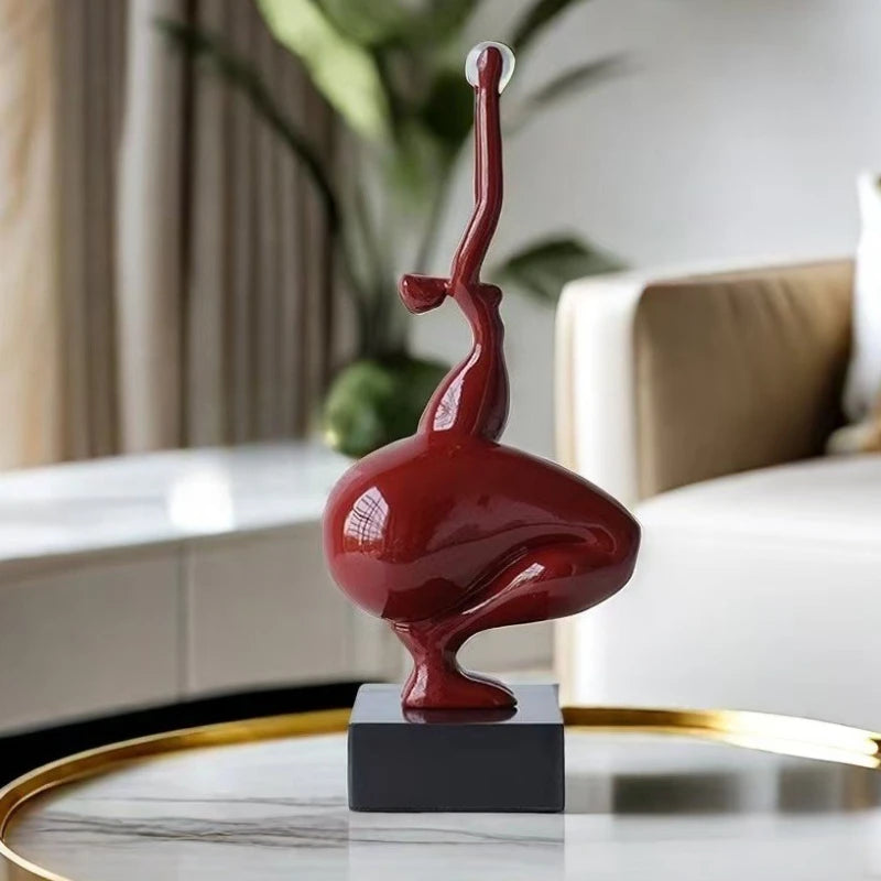 sculpture abstraite résine rouge argenté contemporaine lisse brillante base carrée noire chambre coucher decoration