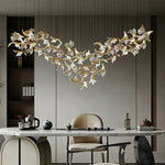 suspension lumineuse moderne élégante dorée feuilles stylisées transparente 120cm 170cm 200cm lumière chaude 3000k