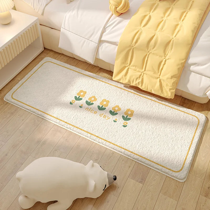 Le tapis de sol avec motif de fleurs jaunes crée une ambiance chaleureuse et agréable dans cette chambre au style épuré.