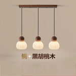 suspension lumineuse trois abatjour bois foncé blanc laiteux moderne minimaliste