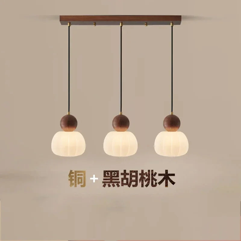 suspension lumineuse trois abatjour bois foncé blanc laiteux moderne minimaliste