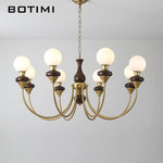 lustres modernes chandelier or marron foncé ampoules led globes opaques éléments décoratifs