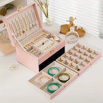 boîte rangement bijoux cuir blanc moderne élégante poignées métalliques verrouillable intérieure motifs géométriques