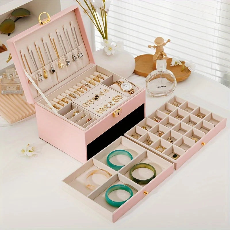 boîte rangement bijoux cuir blanc moderne élégante poignées métalliques verrouillable intérieure motifs géométriques