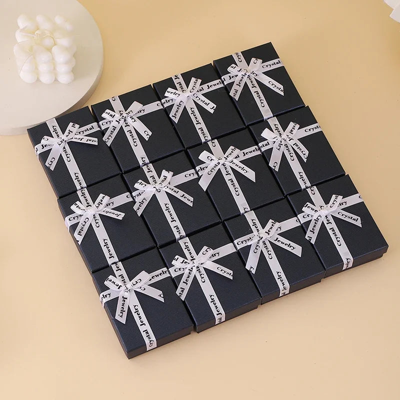 boîtes bijoux noir blanc ruban classique rangement boucles oreilles anneaux papier mat opacité
