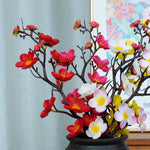 décoration intérieure branche artificielle fleurs simples couleur rouge blanc rose jaune naturel minimaliste