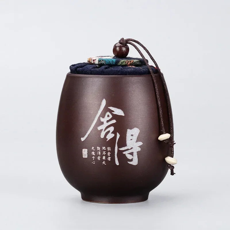 pot thé marron imprimé floral couvercle texte blanc classique traditionnel cordon boule bois épices