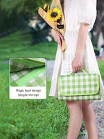 serviette pique nique pliable carreaux blancs moderne orange vert rouge jaune pratique poignées camping
