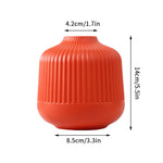 vases modernes orange blanc vert rayures horizontales opaques décoration intérieure papier bougie fleurs artificielles