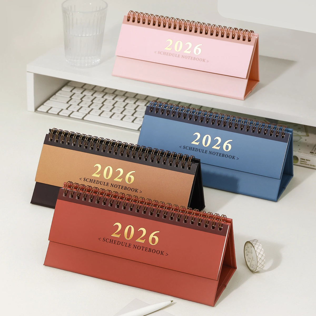 calendrier mural 2026 orange bleu rose papier étoiles moderne minimaliste spirale symboles décor