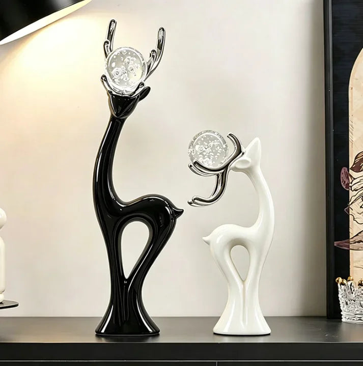 statues cerfs noir blanc sphères verre argentées décoration moderne salon meuble tv armoire vin