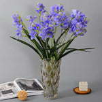 décoration intérieure bouquet artificielle orchidée blanc bleu rose feuilles verte moderne minimaliste