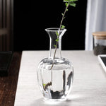 vases verre transparent modernes élégants branches feuilles roses arrangements floraux table maison mariage