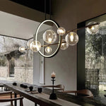 suspension lumineuse moderne noir boules transparentes scandinave chaînes suspendues interrupteur poussoir lumière salon cuisine