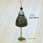 cloche décorative artisanale bronze doré ornements floraux poissons vintage pendentif métallique
