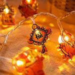 guirlande lumineuse chinoise festive lions poissons lanternes caractères rouges orange doré