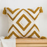 coussin décoratif boho chic blanc bleu marron beige doré motifs géométriques pompons coton