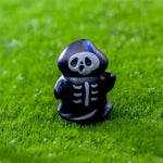 figurines halloween sorcière fantôme citrouille squelette résine noire blanche verte Jaune