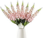 décoration intérieure bouquet artificiel moderne élégant vase livres bougies anniversaire mariage baby shower