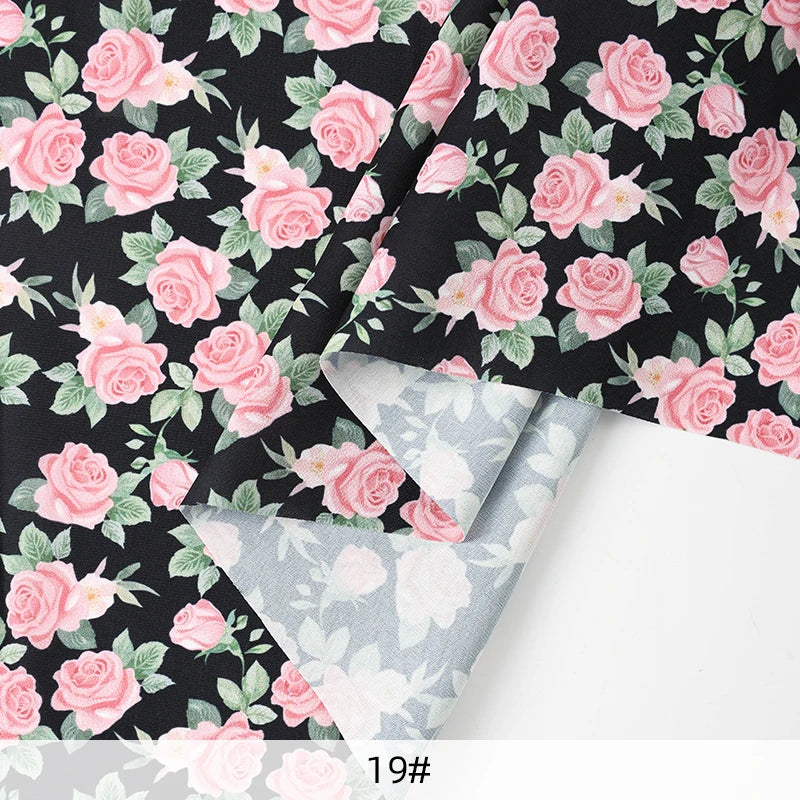 tissu mousseline polyester imprimé fleurs roses fond noir couture robe chemisier rideau diy