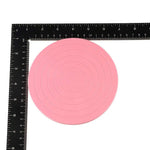 support présentation moderne plastique couleur beige rose rayures concentriques diamètre 10cm opacité