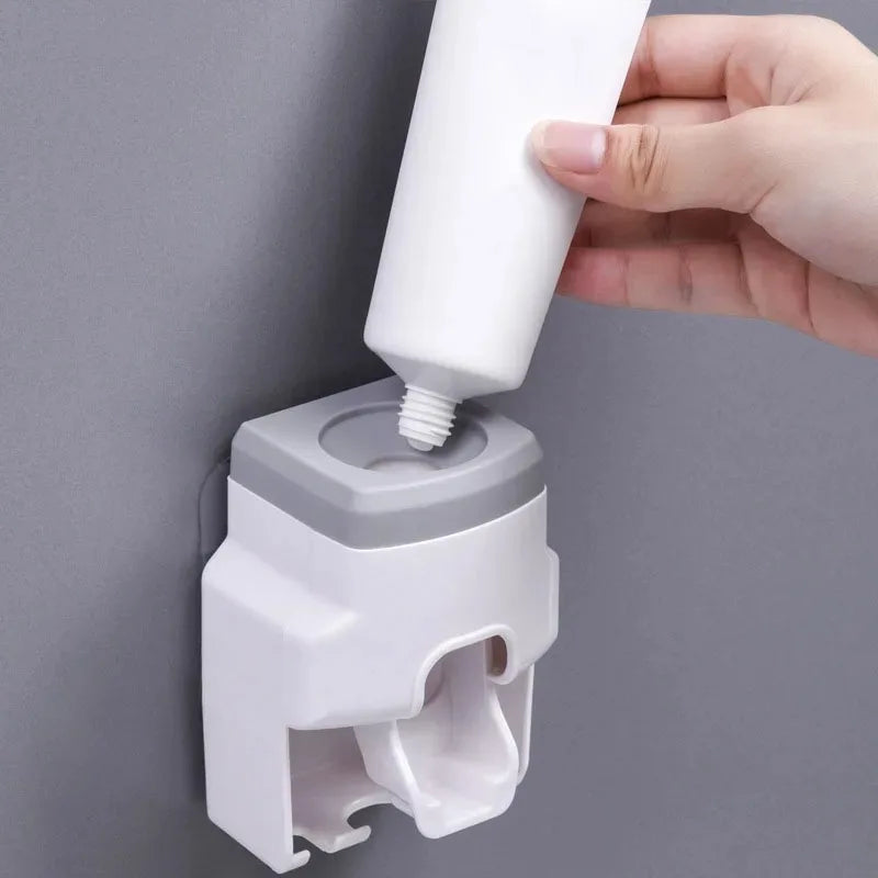 distributeur brosse dents adhésif moderne blanc rose gris matériau plastique salle bains
