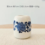 vase céramique blanc bleu fleurs stylisées artisanal traditionnel décoration intérieure pot fleurs