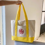 sacs toile colorés blanc vert violet rouge jaune logo trader joes poignées tissu casual