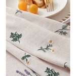 nappe coton brodée fleurs verte jaune violette rustique serviettes assorties tissage uni opaque salon
