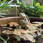 statue tortue pêche carapace hexagonale marron vert ligne jaune leurre poisson extérieur jardin decoration