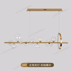 suspension lumineuse moderne or boules verre transparentes têtes G9 led chambre cuisine
