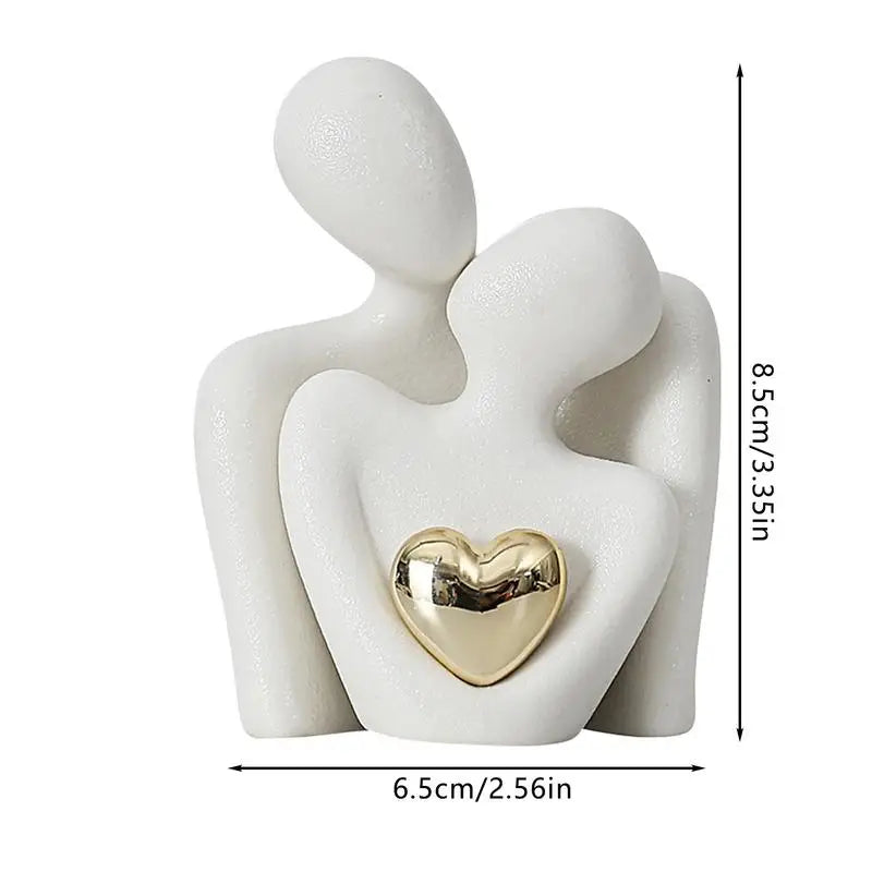 statuette couple stylisé blanc noir cœur doré moderne minimaliste or texturée aspect granuleux