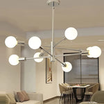 lustre moderne 10 ampoules doré noir chrome sphères blanches structure métallique scandinave