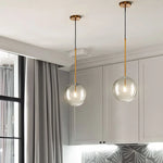 suspension lumineuse moderne transparente dorée brillante scandinave câble électrique fixée