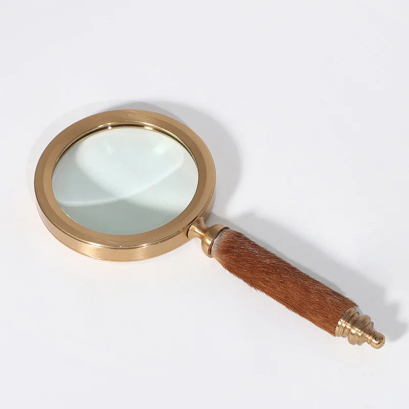décoration vintage loupe or marron poignée cuir serpent transparente élégante maison