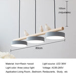 lampe suspendue moderne minimaliste led gris blanc rose jaune bleu oiseaux résine bois
