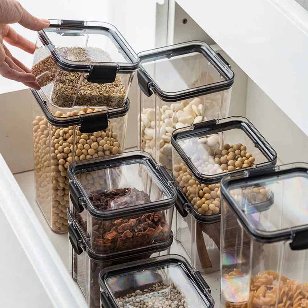 boîtes rangement alimentaire transparentes poignées noires multiple tailles réutilisables modernes pratiques épices pâtes graines