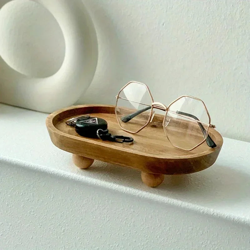 plateau ovale bois naturel minimaliste pieds boules anneaux bracelets tasses fruits bougies assiettes