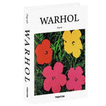 décorations livres fausses minimaliste pop art table blanche noire orangée