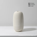 vases céramique blancs rayures horizontales modernes fleurs artificielles