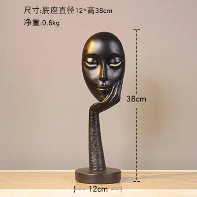 masque sculptural contemporain noir blanc doré finement sculpté base circulaire ornement salon