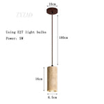 Lampe suspendue moderne minimaliste pierre beige clair texture granulée câble noir pendentif chambre salon