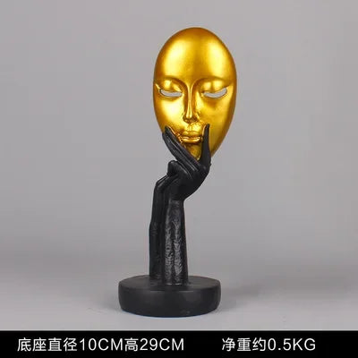 masque sculptural contemporain noir blanc doré finement sculpté base circulaire ornement salon