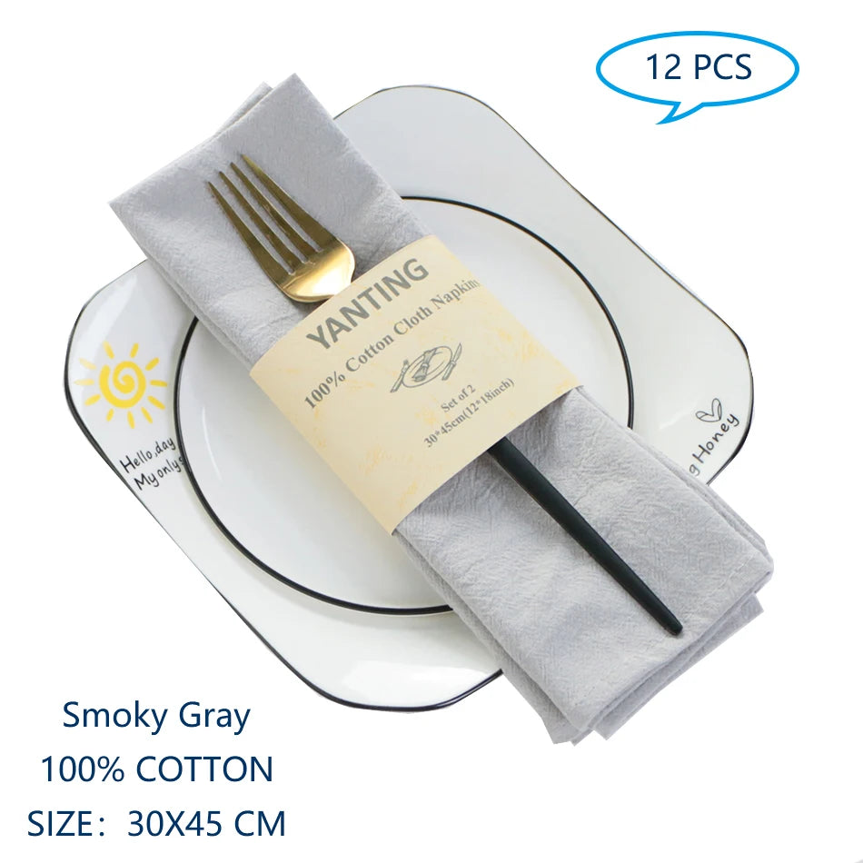 Des serviettes en coton gris foncé de 30 cm x 45 cm, en paquet de 12, idéales pour les repas et la cuisine.