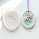 cadre décoratif ovale silicone fleurs reliefs artisanal clips ruban couleurs variées maison